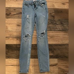 light blue mid - rise skinny jeans